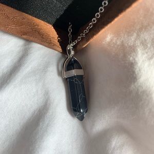 Brand new (still in box) black gemstone necklace.